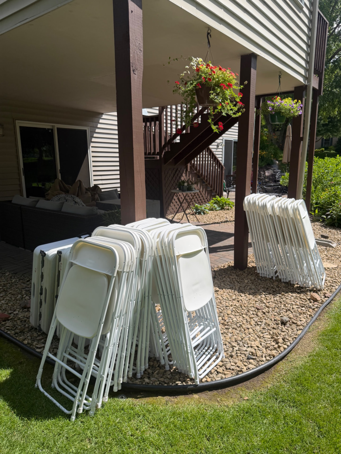Folding tables and chairs delivered to a residential backyard patio